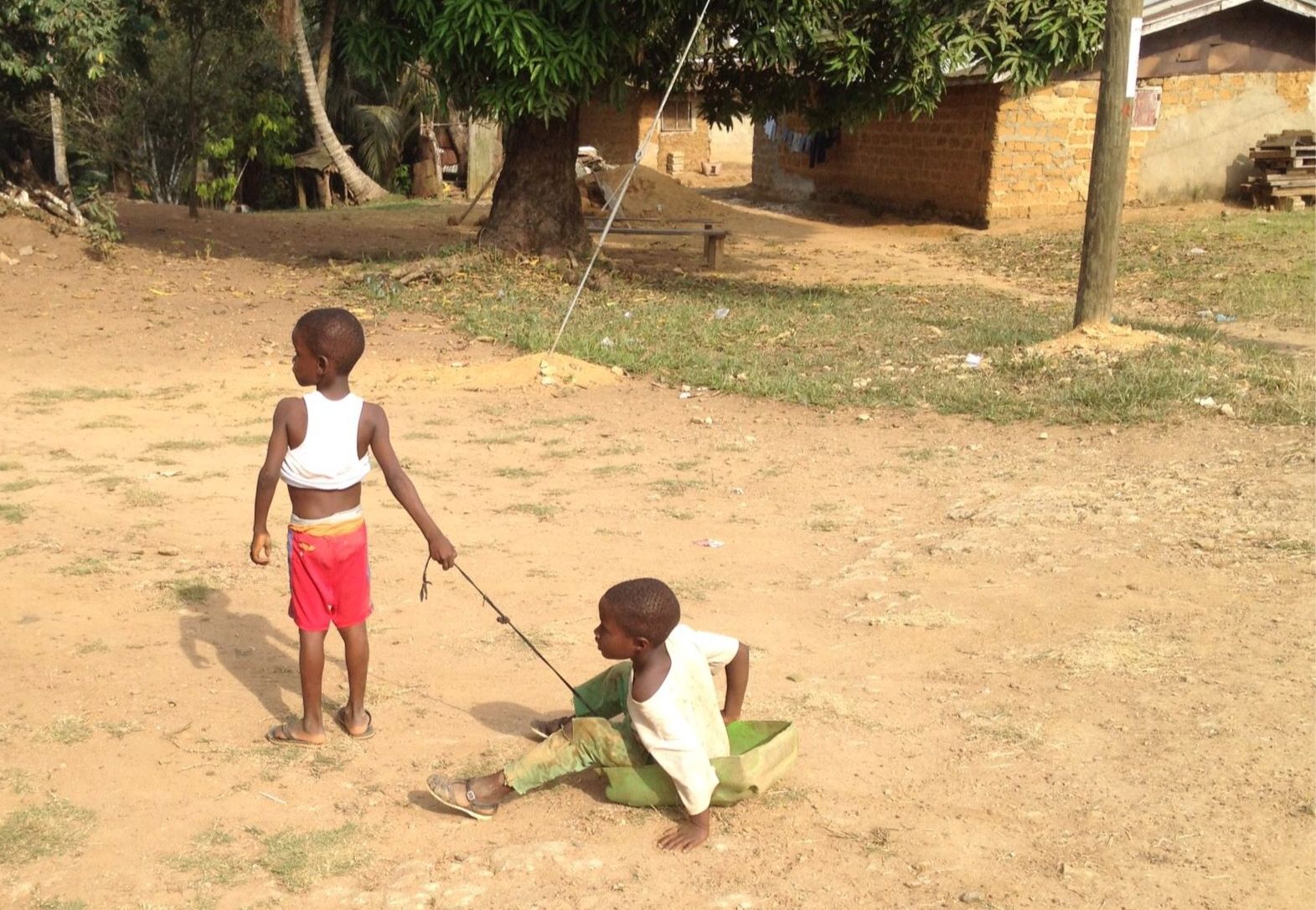 kid-pulling-little-brother-in-a-tub